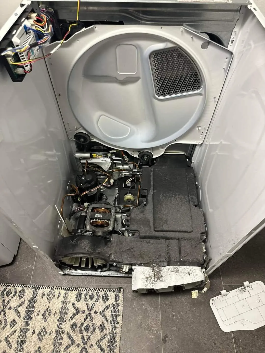 The inside of a dryer with burned lint